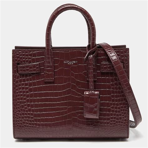 ysl sac de jour burgundy|Sac De Jour Nano patent leather tote bag in burgundy .